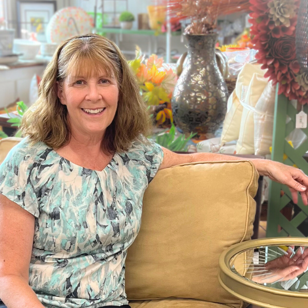 Facebook Live with accent chair and gold edge table