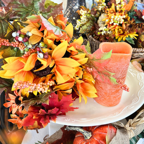 Fall florals, sunflowers and orange candle on consignment